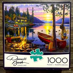 a jigsaw puzzle with a boat on the lake