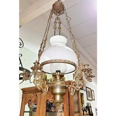 a chandelier hanging from the ceiling in a room