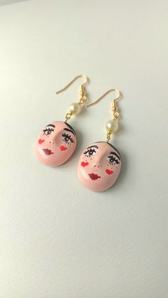 Handmade lovely polymer earrings, with clay lady face charm. They are very playful and quirky, adds unique look to your style. Length from the hook: 6 cm / 2.36 inches. Earrings will arrive packed in cute decorative paper, so you will be able to gift them without the need for additional gift wrapping. :)  Disinfect the hook before wearing. CARE INSTRUCTIONS:  Do not keep your earrings in direct sunlight as it may affect the metal color. Be gentle with your earrings; avoid playing with them or pu Polymer Clay Face, Gothic Heart, Clay Face, Quirky Earrings, Heart Face, Clay Faces, Polymer Earrings, Face Earrings, Le Crochet