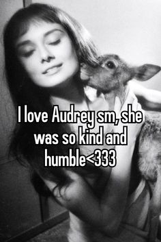 a woman holding a lamb in her arms and the words i love audrey sm, she was