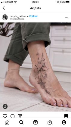 a woman's foot with a flower tattoo on it