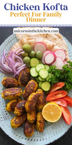 chicken kofta dinner on a plate with vegetables and pita bread