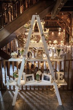 an upside down table with pictures and candles on it