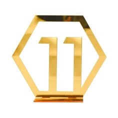 the number 11 in gold is displayed on a white background