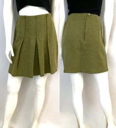 "Vintage 60's Sears Jr's Bazaar, Green Pleated, Mini Skirt (Size 6) This 60's Skirt comes in a pea green wool and is unlined, and is a flare shape with pleats, and has a back zipper closure and sits well above the knee in length. *The skirt is unlined. *Label varified by the vintage fashion guild. 100% Wool Made in USA *This skirt is in excellent condition. *This skirt ships Priority Mail within the US Only. Size: (M) Modern Day 6 (Tag Size: 11) Waist: 26\" Hips: 36\" Length: 17 1/2\" Weight: 14 oz *Follow FreshandSwanky on Instagram" Retro High Waist Fitted Skort, Retro High-waist Fitted Skort, Retro Fitted Skort With Lined Skirt, Retro Fitted Short Skirt, Retro Pleated Skort, Retro Pleated Short Skirt, Vintage Fitted Mini Pleated Skirt, Retro Short Pleated Skirt, Fitted Vintage Mini Pleated Skirt