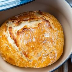 a loaf of bread sitting in a bowl