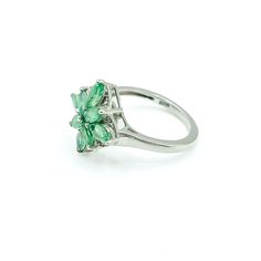 Sterling Silver Emerald Floral Ring Size 5. This Platinum plated Sterling Silver ring features eight marquise cut green Emerald stones prong set in a floral pattern. This makes a great birthday gift for a young lady. Emeralds symbolize love and truth and they are also the May Birthstone. Green is the color of life. It is often associated with nature, health, growth and prosperity. It represents hope for the future.Ring is pre-owned and in great condition. Buy with confidence knowing that all our Classic Green Marquise Rings, Formal Green Marquise Emerald Ring, Green Marquise May Birthstone Jewelry, Emerald Flower Ring Gift In Green, Fine Jewelry Flower Ring With May Birthstone, Green Marquise Jewelry For May Birthstone, Elegant Flower Shaped Emerald Ring For Gift, Green Flower-shaped Jewelry For Anniversary, Green Flower-shaped Anniversary Jewelry