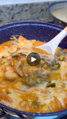 a blue bowl filled with food on top of a stove