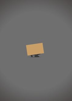 a brown cardboard box sitting on top of a metal object in the middle of a gray background