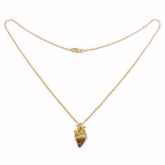 a gold necklace with a heart shaped pendant on the front and back of it's chain