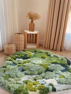 a living room area with a rug on the floor and two vases in the corner