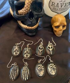 Dangle earrings each based upon a different story/novel in the gothic horror genre. Clay charms imposed on bronze backing. (Frankenstein, The Monkey's Paw, & Tell Tale Heart are sold out) Black Jewelry For Halloween Fantasy Events, Gothic Skull Earrings For Halloween, Goddess Nature, Tell Tale Heart, The Monkey's Paw, Horror Earrings, Snake Choker Necklace, Horror Genre, Halloween Clay