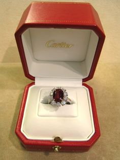 a red and white box with a ring in it