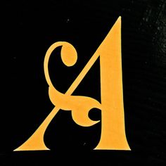 a black and yellow logo with the letter a on it