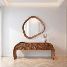 a wooden bench sitting under a round mirror on top of a wall next to a vase