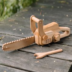 a wooden toy that is laying on the ground