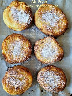 four powdered sugar - covered cream cheesecakes on a baking sheet with the title above it