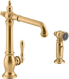 a golden faucet with two handles and nozzles