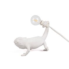 a white animal lamp with a light bulb attached to it's head and arm