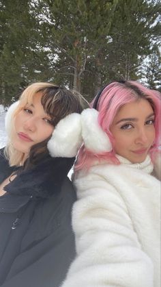 two women taking a selfie in the snow