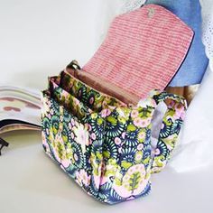 an open purse sitting on top of a white table