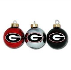 three christmas ornaments with the letter g in red, white and black on each ornament