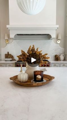 a white kitchen counter top with candles on it