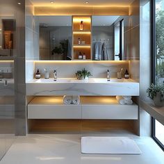 a modern bathroom with two sinks, mirrors and towels on the counter top in front of a large window