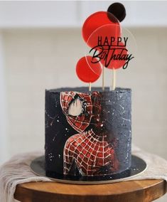 a spiderman birthday cake on a table