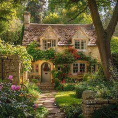 a house that is surrounded by flowers and trees