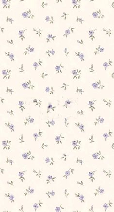 a white wall with purple flowers on it