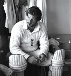 black and white photograph of a man sitting in a chair