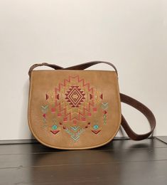 To see more treasures that need  a home please visit!! Myvintagelittlestore.etsy.com This listing is for a beautiful Light Tan with Brown Catchfly Kristan crossbody/shoulder purse on the front it has a beautiful Aztec Embroidery design. It measures 26 inches and has 5 more inches left to make it longer. this purse Features.   -1 Compartment  -1 zip pocket - Front swap pocket Front Flap Magnetic snap closure  -1 Organize pocket  For more details please zoom in on the  pictures and if you need any more or have any questions please don't hesitate to send me a message I will gladly send them to you, Thank you for stopping by  you are welcome to come back anytime...  All my items are sold vintage I try to describe them to the best of my ability, they may have some imperfections due to age and w Aztec Embroidery, Christmas Tree Candle Holder, Tree Candle Holders, Candle Tree, Brown Shoulder Bag, Have A Blessed Day, Light Tan, Shoulder Purse, Beautiful Lights