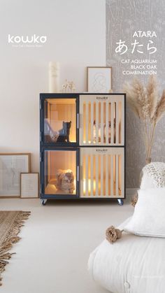 a cat is sitting in an open cabinet on the floor next to a white bed