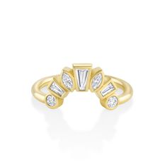 a yellow gold ring with three baguettes and two diamonds on the side, set in