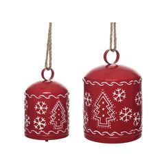 two red bells decorated with white snowflakes and christmas tree decorations hanging from twine cords