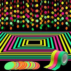 an image of a computer screen with colorful dots on it and a roll of tape next to it