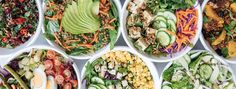 several bowls filled with different types of salads and vegetables in them, all lined up side by side