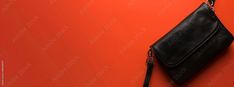 Facebook Cover Photo of a Black Fashionable Purse with a Minimalist Design on a Vibrant Orange Background Stock Photo | Adobe Stock Facebook Covers, Purse Styles