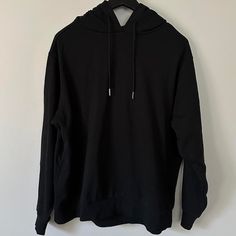 Brand New Oversized Black Top With Adjustable Hood, Black Oversized Hoodie Athleisure Style, Black Oversized Hoodie In Athleisure Style, Black Long Sleeve Basic Hoodie, Basic Black Long Sleeve Hoodie, Basic Black Hoodie Sweatshirt, Black Stretch Urban Hoodie, Fall Streetwear Stretch Hoodie, Stretch Hoodie Sweatshirt For Streetwear