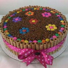 a cake decorated with chocolate and colorful candies