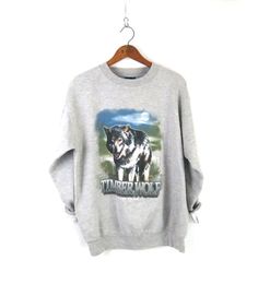 "Timber Wolf vintage pullover sweatshirt in gray M E A S U R E M E N T S - are taken with garments laying flat, across seam to seam ------------------------♥---------- tag: M bust: 22\" (armpit to armpit) | length: 26\" condition: nice vintage  ✩ Every item we sell is pre-loved authentic vintage, ONE-OF-A-KIND, and anywhere from 20 to 60+ years old! You will receive the exact item and size shown in the photos and measurements. Please let us know if you have any questions.✩ ✩ Newly stocked vintag Grunge Gray Sweatshirt For Fall, Fall Grunge Gray Sweatshirt, Winter Grunge Sweatshirt With Relaxed Fit, Winter Grunge Relaxed Fit Sweatshirt, Winter Band Merch Crew Neck Sweatshirt, Band Merch Crew Neck Sweatshirt For Winter, Vintage Graphic Print Winter Sweatshirt, Vintage Winter Graphic Print Sweatshirt, Winter Vintage Graphic Print Sweatshirt