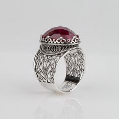 This Ruby Corundum Bold 925 Sterling Silver Filigree Ring has Crown natural gemstone setting. It has unique, artistic ornate Lacey filigree design. Size 5-12, to fit the fingers of every art loving woman as her Boxed Christmas Gift. The stone is a sizable 13X18 mm oval weighting minimum 10 carat each. The ring is bold, measures approximately 0.8 Inch long. The side filigree adds additional art and beauty. The band tapers at the bottom for comfortable fit and wear. This ring will come in a design Gemstone Setting, Ring Crown, Crown Ring, Sterling Silver Filigree, Filigree Design, Filigree Ring, Silver Filigree, Artisan Craft, Jewelry Gift Box