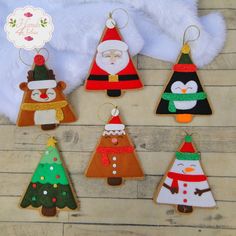 christmas ornaments are arranged on a wooden table