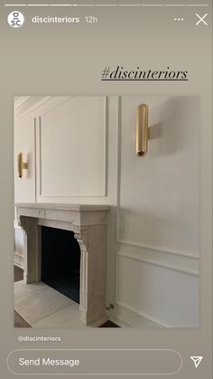 a fireplace in a room with white walls and gold trim on the door, above it is an advertisement for designers