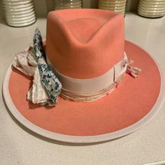 - Felt In Western Weight In Pink With Oversized Bow - Size 7 3/8 - 4.5” Crown - 3.5” Brim - Pinched Crown - 2" Grosgrain Band And Bow + Edge Binding In Light Pink - Mulitcolored Silk Wraps With Custom Gold Tone Charm Added - Natural Leather Sweatband - Interior Silk Crown Lining - No Mass Production, Less Waste, More Love Brand New, No Wear To Sweatband. Inner Price Tag Still Inside. This Fuschia Hat Is So Special It Was Custom Made For The Loveshackfancy Collaboration Launch. Designer Curved Brim Hat For Spring, Handmade Pink Fedora Hat, Luxury Pink Fedora With Curved Brim, Pink Wide Brim Fedora, Pink Fitted Brimmed Fedora, Pink Fedora With Curved Brim, Silk Wrap, Fedora Hat, Natural Leather