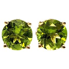 Simple yet timeless peridot solitaire stud earrings. These gorgeous bright yellowish-green peridot and 14 karat yellow gold pierced ear studs are the epitome of minimalist elegance. They give just the right pop of color for everyday wear and the classic design ensures they will never go out of style. Earring type: Stud Metal: 14K Yellow Gold Natural Peridot: 6.20 carat total weight Peridot cut: Round Brilliant Peridot color: Yellow Green Weight: 3.8 grams Stone diameter: 9 mm Backing types: Butt Peridot Color, Pierced Ear, Round Solitaire, Solitaire Studs, Green Peridot, Ear Studs, Jewelry Earrings Studs, Round Brilliant, Ear Piercings