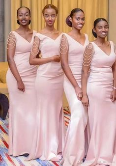 the bridesmaids are all wearing pink dresses and one is holding her hand on her hip