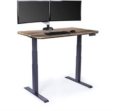 a computer desk with two monitors on it