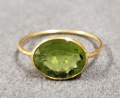 kJewelryaccessories 18k Gold Statement Green Peridot Ring For Women & Girl With Bezel Setting, Big Size Peridot, Gold Jewelry, Birthstone, Oval Shape, Hammered gold, Valentine's Gift, Three Stone Ring, Love & Friendship Ring, Engagement Gold Ring, Pretty Gold Rings, Adjustable Ring, Engagement Ring, Statement Ring, Christmas Gift Products Features :- 1. 18k Gold Peridot Gold Ring 2. Made to Order 3. Gemstone - Peridot 4. Jewelry Type - Gold Ring 5. Total Weight - 1.950 Gram Approx 6. Peridot Wei Luxury Oval Peridot Rings, Oval Peridot Jewelry For Formal Occasions, Oval Hallmarked Peridot Jewelry, Yellow Gold Polished Peridot Jewelry, Yellow Gold Peridot Jewelry With Polished Finish, Hallmarked Oval Peridot Jewelry, Formal Oval Peridot Jewelry, Oval Yellow Gold Peridot Rings, Oval Peridot Ring In Yellow Gold